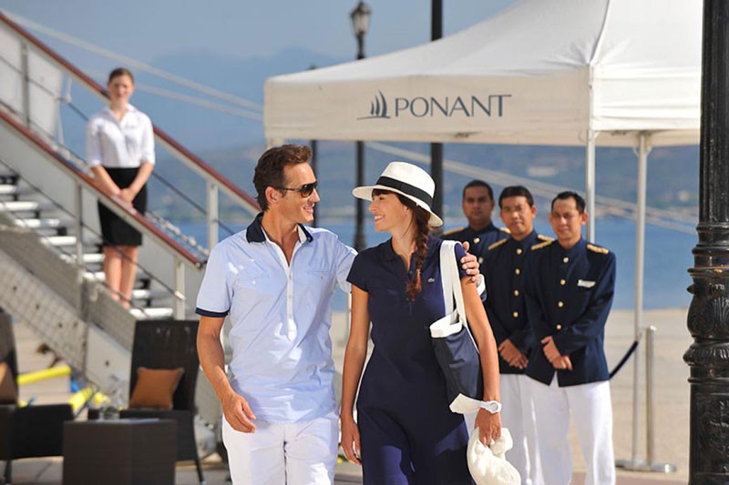 Couple and PONANT cruise ship, signature experience